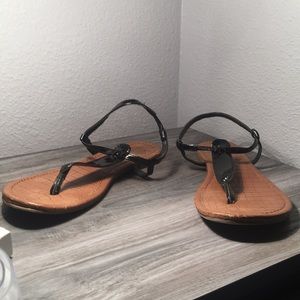 tan and black sandals